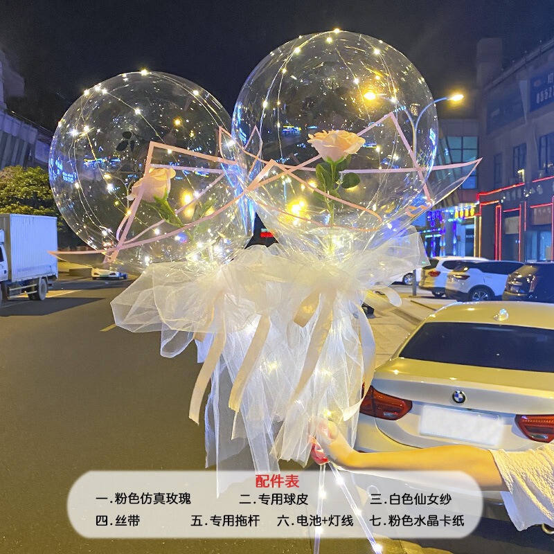 光る夜市の円形の赤い屋台のネットを並べてボールを押して会の風船のイルミネーションの明かりの告白のロマンチックな波の地帯のスーツを押します。|undefined