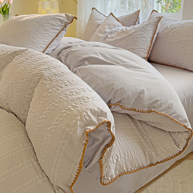 Cama de algodón lavado cepillada simple de cuatro piezas Four Seasons 2025 nueva sábana funda de edredón sábana ropa de cama de dormitorio