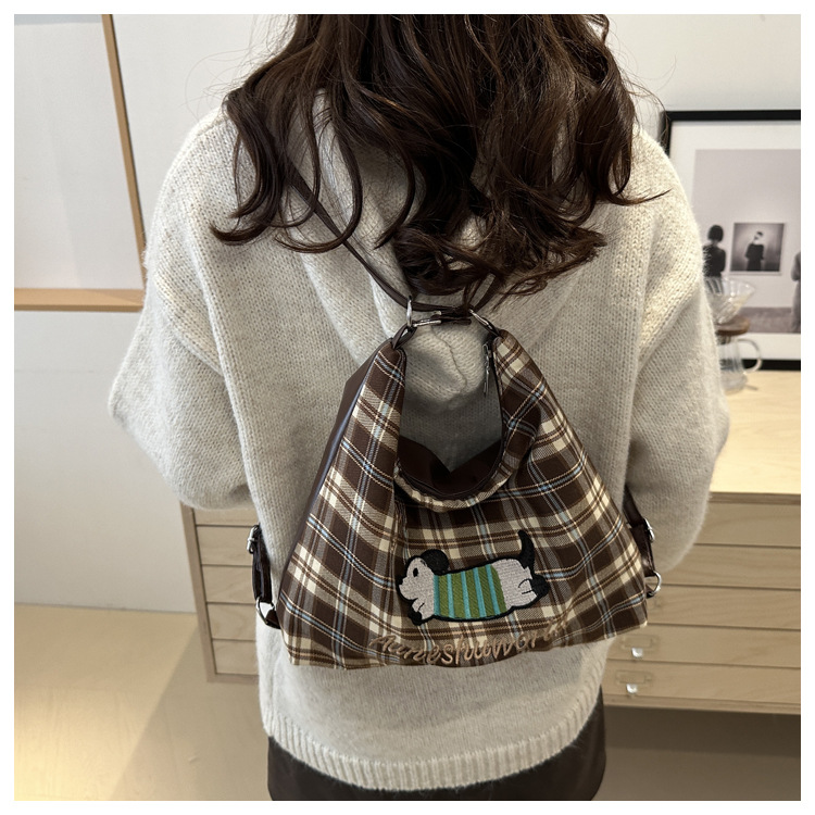 A new 2024 trendy and stylish backpack for women, featuring a cartoon checkered single-shoulder crossbody bag and a tote bag undefined