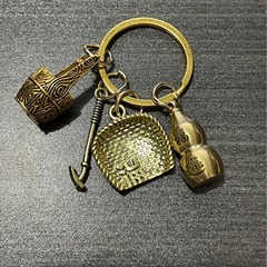真鍮のキーホルダー純銅の手作りのペンダントは箕のヒョウタンの創意的な個性の自動車のキーチェーンのペンダントの贈り物です。