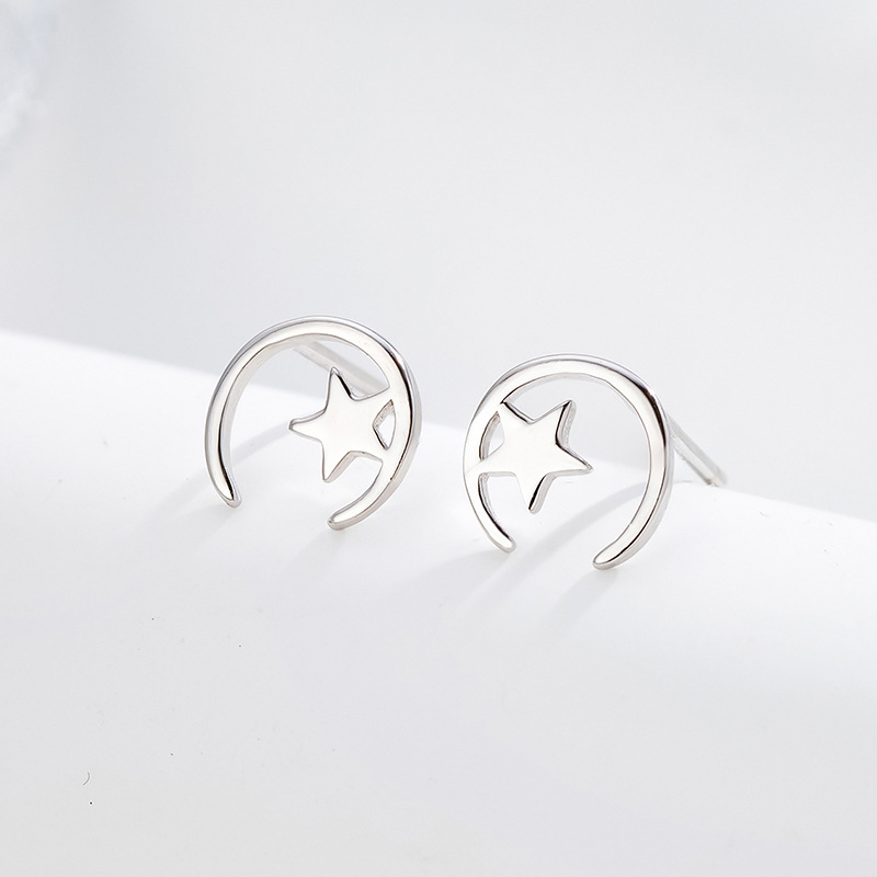 Minimalista estrella Luna Stud pendientes 925 Plata estrella Luna Stud pendientes mujeres simple nicho diseño temperamento oído joyería al por mayor
