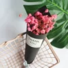 Pink baby's breath + black paper ice cream cone