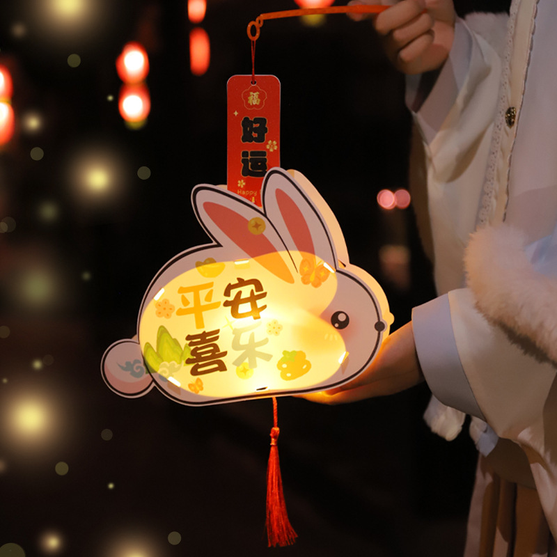 Festival de medio otoño linterna estilo antiguo DIY paquete de material hecho a mano portátil de los niños linterna luminosa lámpara de conejo linterna de PVC