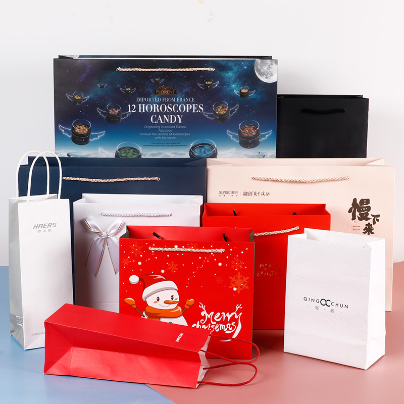 厂家定做白卡纸牛皮纸手提袋 商场礼品包装袋 服装购物纸袋印logo|ms