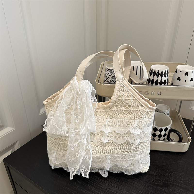 Bolsos de gran capacidad para mujer 2025 nuevo bolso de hombro tejido hueco de encaje de verano para estudiantes universitarios
