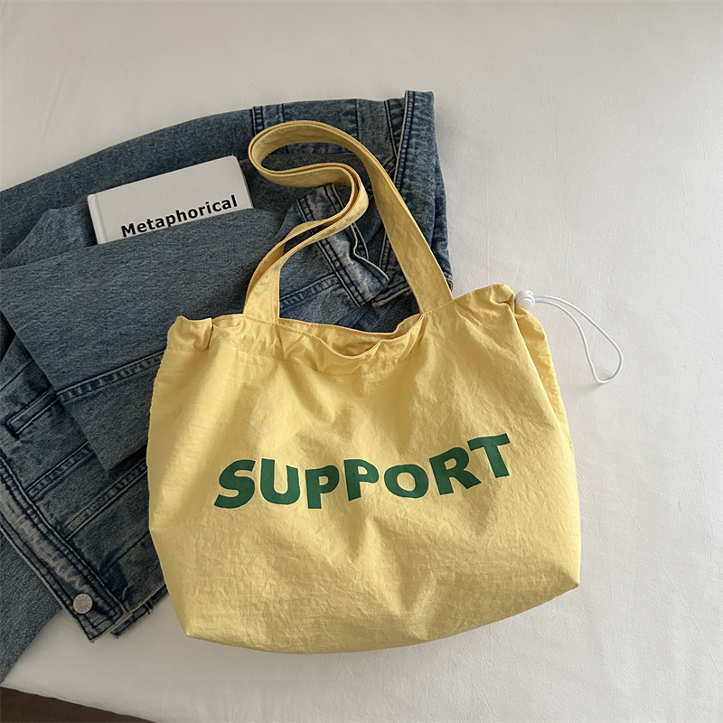 letras coreanas bolsas de lona para mujeres 2024 otoño nuevo relajado bolsas de clase de estudiantes universitarios de gran capacidad bolsas de nylon