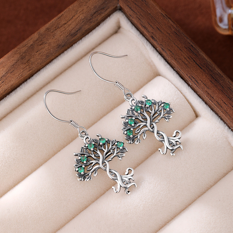 Pendientes con incrustaciones huecas de plata de ley 925 nuevos transfronterizos Pendientes INS Tree of Life Pendientes de todo fósforo retro europeo y americano femenino