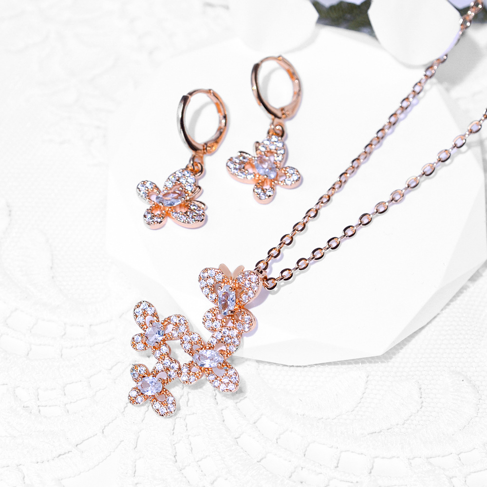 Diseño de mariposa popular transfronteriza aretes de zircon collar conjunto de joyería para mujeres pendientes de aretes de zircon colgante joyas exquisitas para mujeres