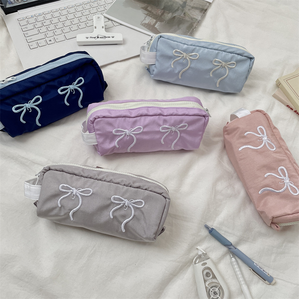Capacious universal pencil case with bow