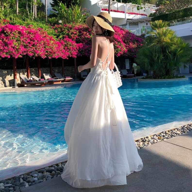 Real shot fairy beach dress white niche strap backless dress women's summer seaside holiday ins super popular Real shot fairy beach dress white niche strap backless dress women's summer seaside holiday ins super popular