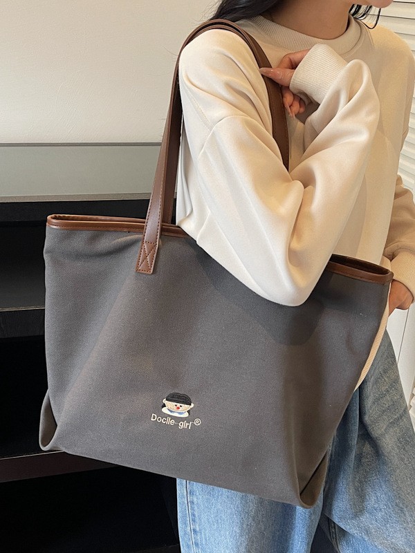 Bolsa de lona de gran capacidad para mujeres 2025 nuevo estilo urbano simple de viaje al trabajo sensación de alta calidad de moda versátil bolso de mano