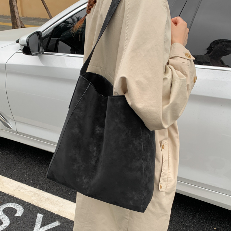 Cross-border 2025 otoño y invierno nuevo retro bolso de braza alta sensación de viaje de gran capacidad bolso de cubo de viaje de mujer bolso de hombro