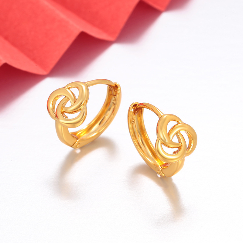 Xuping Europa y los Estados Unidos transfronterizos simples pendientes de flores huecas imitación de oro ligero lujoso nicho de diseño de pendientes al por mayor mujeres