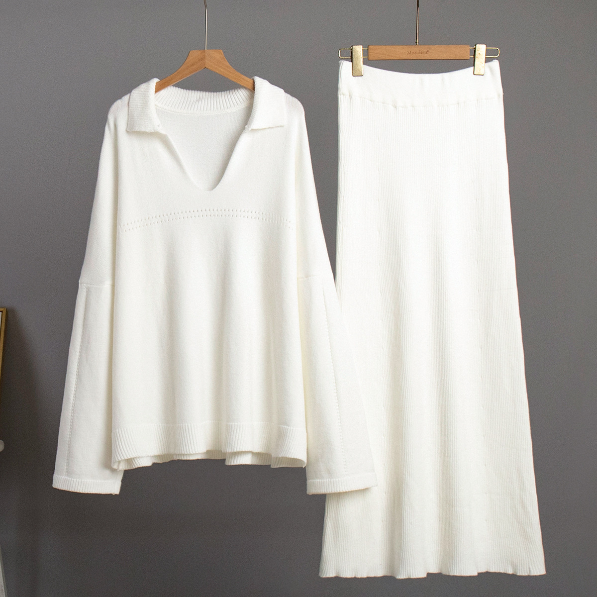 Conjunto de punto transfronterizo Europa y los Estados Unidos 2025 invierno nuevo estilo de moda minimalista viento suéter de punto de cuello V conjunto de falda de busto