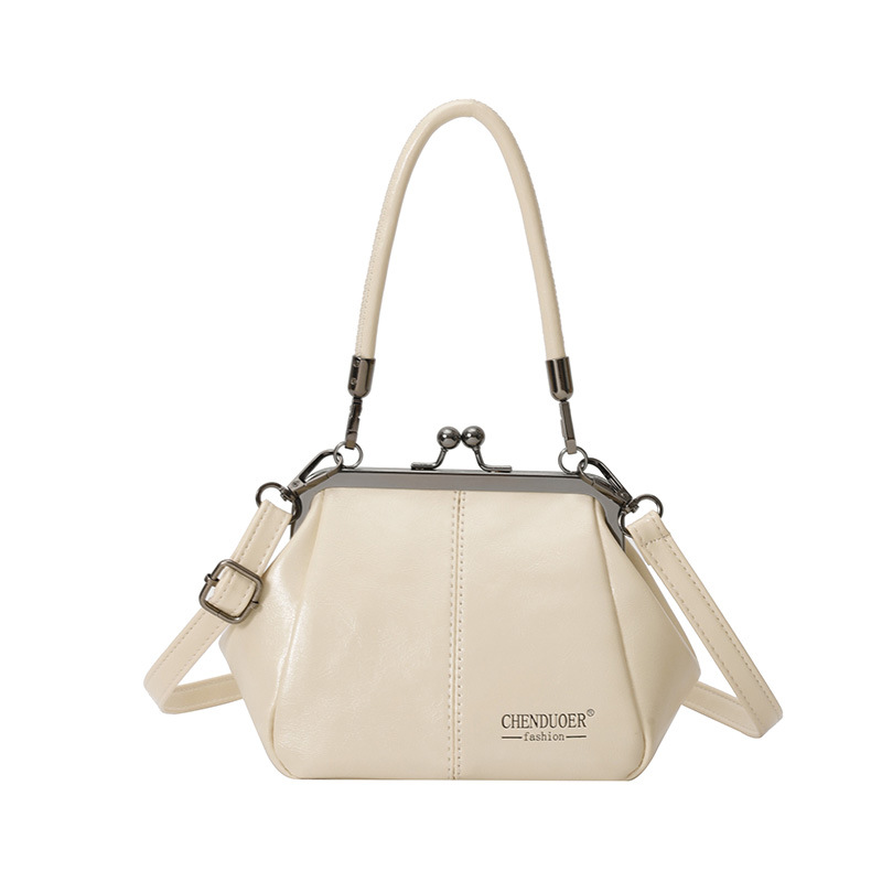 Bolso de conchas de moda para mujeres 2026 comercio exterior nuevo bolso coreano de abrazadera alta sensación retro versátil mochila