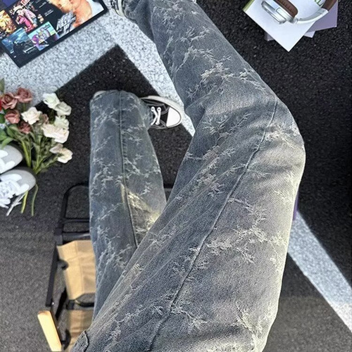 American-style high-street vibe camo tie-dye denim jeans for men: loose-fit, casual, washed-out look with dramatic ink-splashed, vintage-inspired drop-crotch design.