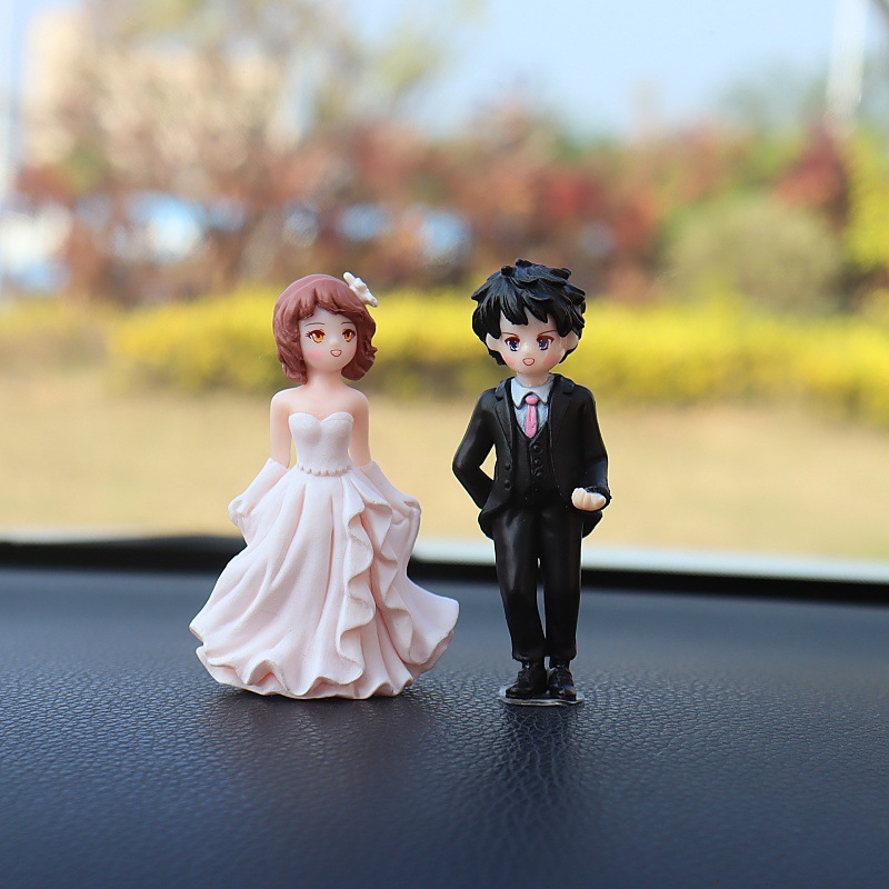 Nuevos accesorios de automóviles consola al por mayor muñecas creativas de dibujos animados accesorios de automóviles decoraciones de boda pareja