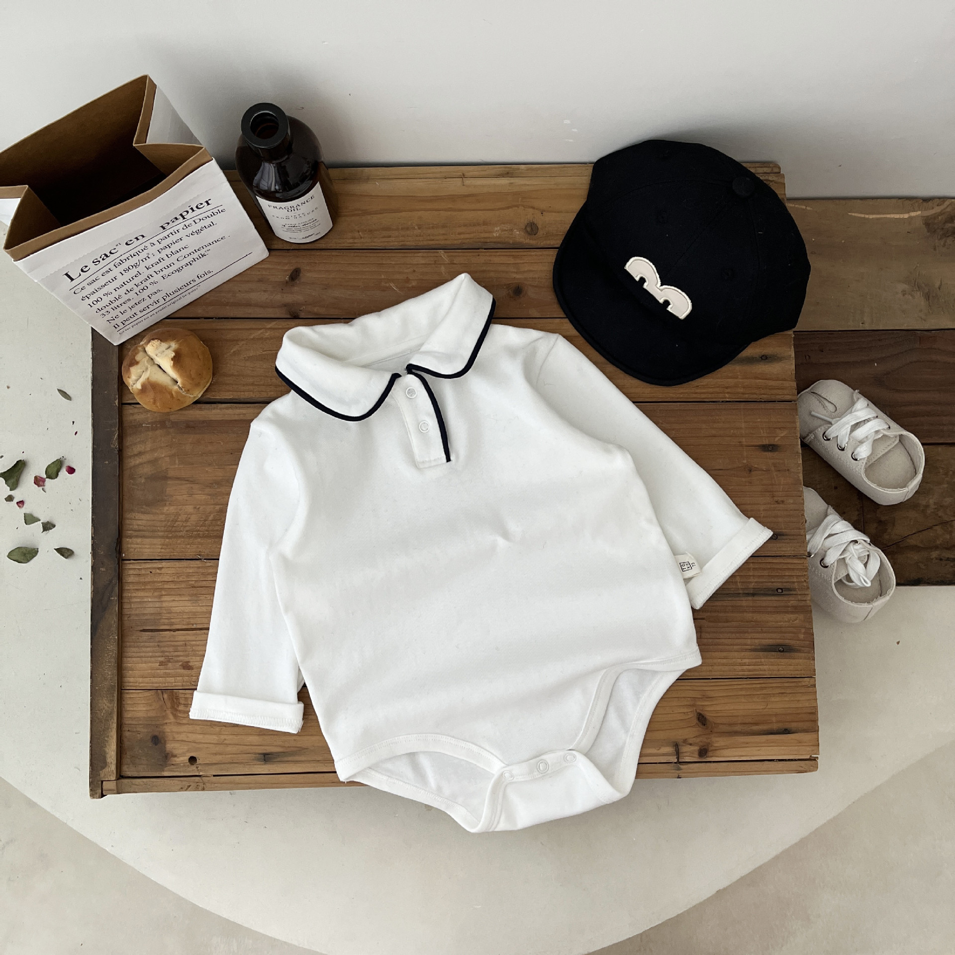 INS Corea del Sur primavera y otoño bebé blanco puro solapa mameluco de manga larga bebé triángulo bolsa pedo mameluco de una sola pieza base de todos los partidos