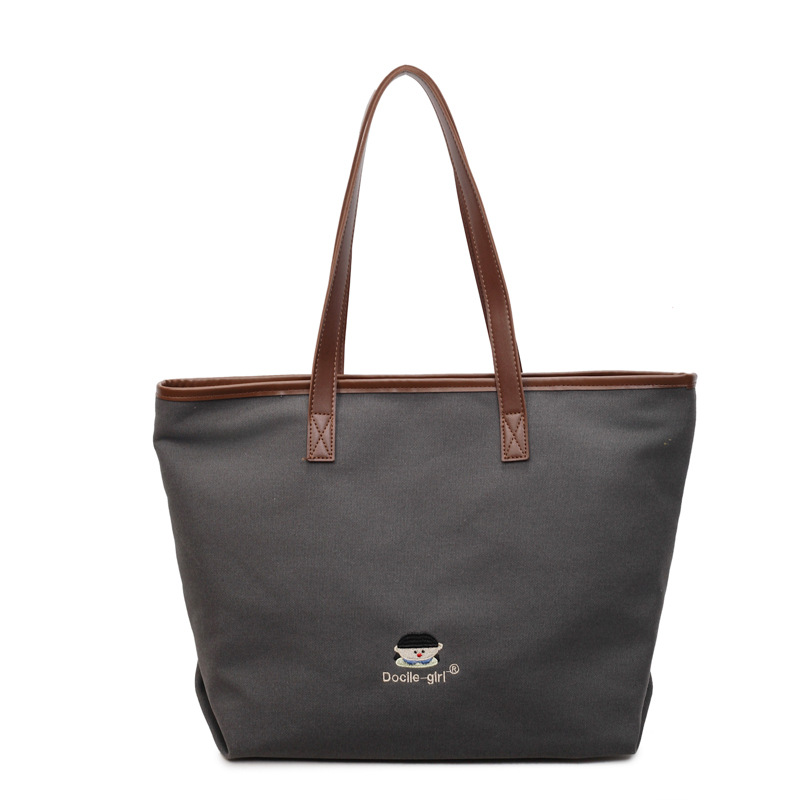 Bolsa de lona de gran capacidad para mujeres 2025 nuevo estilo urbano simple de viaje al trabajo sensación de alta calidad de moda versátil bolso de mano