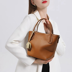 New arrival women's handbag: premium-grade, elegant leather tote-style bucket bag with a chic vegetable-tanned cowhide design—perfect for daily commutes.