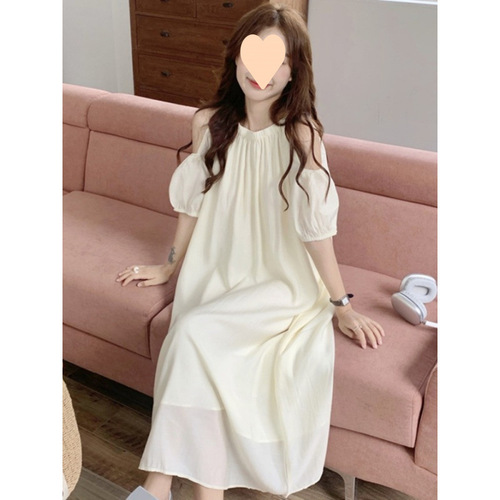 Elevated maternity dress for summer: chic, laid-back design with delicate cutouts and an off-shoulder neckline—perfect for a stylish, mid-length summer look.