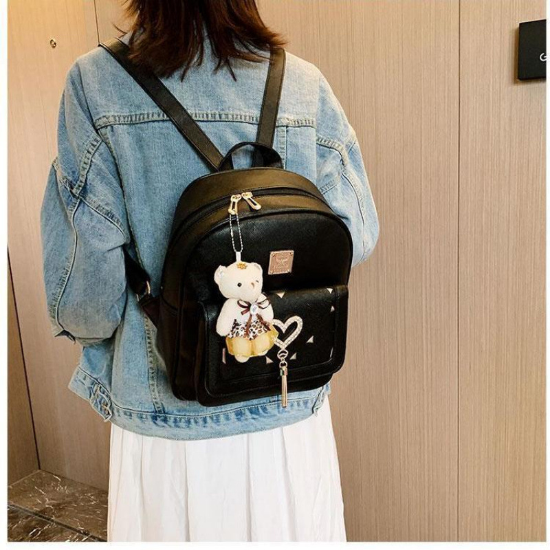 Mochila femenina versión coreana de la moda pu2023 nueva pequeña y fresca borla hueca salvaje casual estudiante mochila escolar mochila