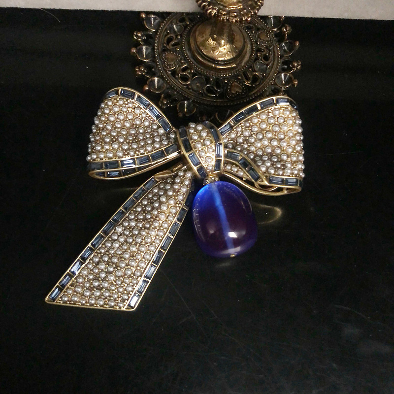 Sophisticated fashionable retro copper brooch with bow