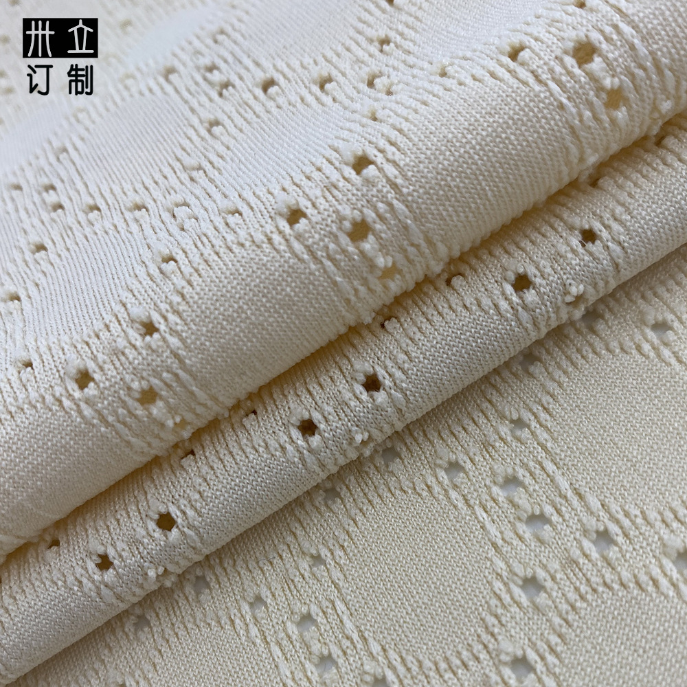 针织提花洞洞布涤氨弹力提花服装面料布镂空连衣裙针织提花面料