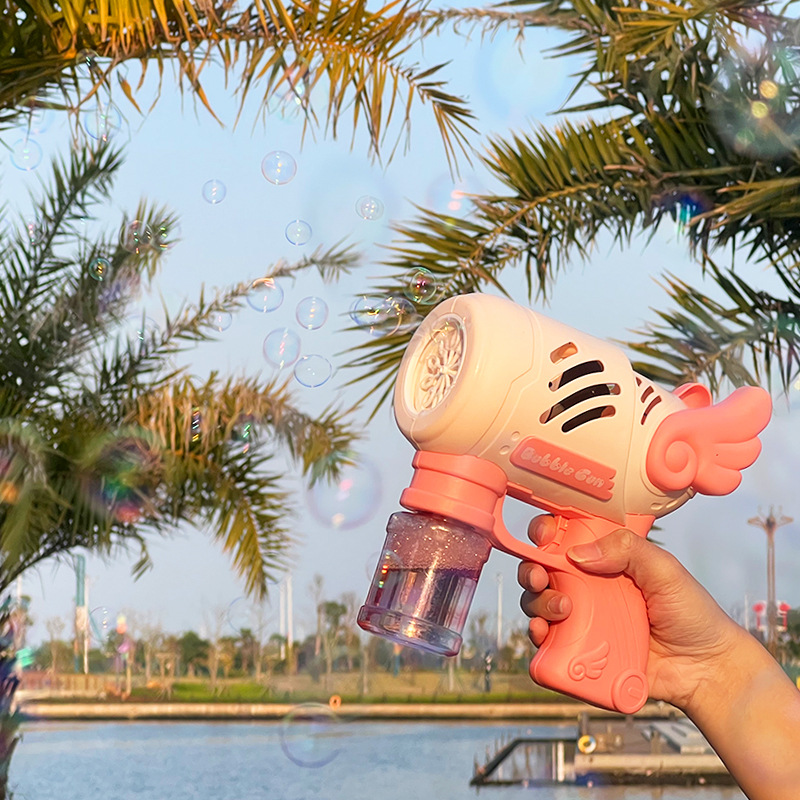 Máquina de burbujas porosas Haimax, alas de juguete, luz, ángel, pistola de burbujas, pistola de juguete de espuma eléctrica, puesto al por mayor