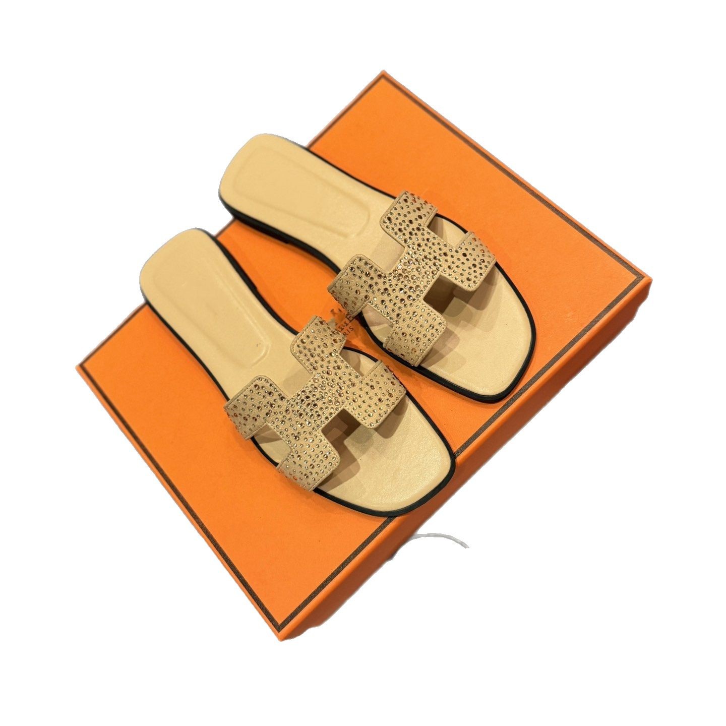 Europa y los Estados Unidos 2025 zapatos caseros de mujer una palabra fuera de H zapatillas de diamante de cuero plano playa casuales zapatillas frías tacones planos resistentes al desgaste