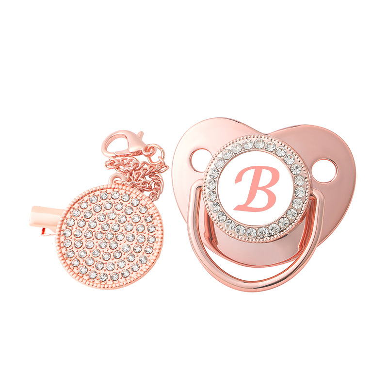 Producto caliente transfronterizo bebé 26 letras de oro rosa calmante pezón destete bebé punto diamante jugar boca con cubierta de polvo