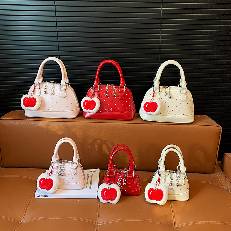 Bolsas coreanas para niños y niñas, bolsas de conchas, bolsas de mano de manzana, bolsas para niños, bolsas de comercio exterior transfronterizas 2026