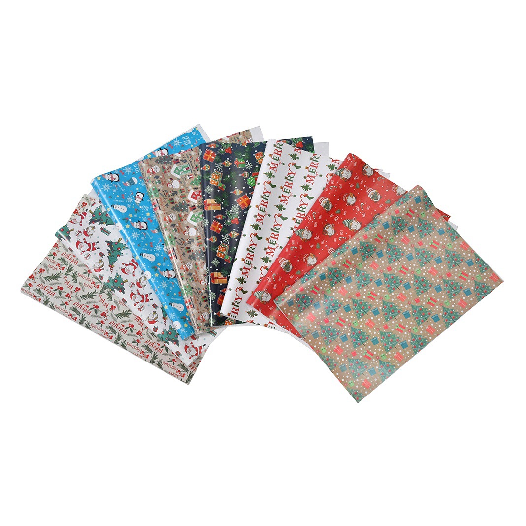Nuevo papel recubierto brillante papel de regalo de navidad papel de regalo muñeco de nieve de dibujos animados árbol de navidad papel de regalo