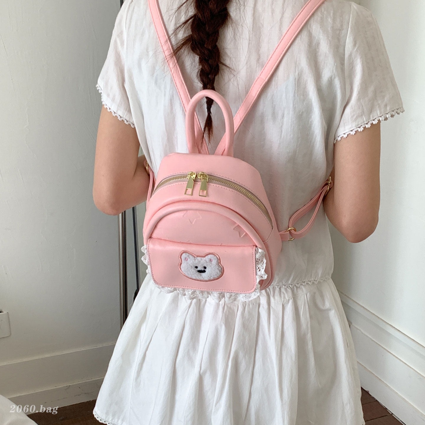 Mujeres nuevas estilos de dibujos animados simples estudiantes 2026 verano universal mochila ligera oso mochila encantador viaje coreano