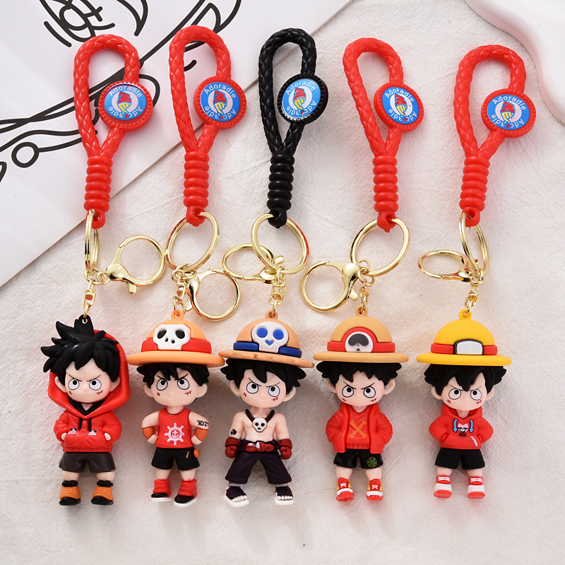 Nuevo One Piece Keychain dibujos animados Luffy muñeca bolsas escolares para niños colgantes muñeca máquina pequeños regalos al por mayor