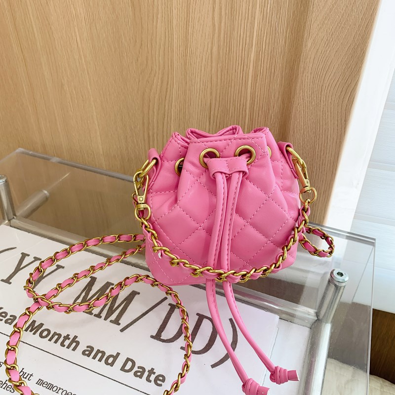 Bolso de hombro para niños y niñas Lingge de moda, cordón de aire extranjero, bolso de cubo de bebé de color sólido simple, nuevo bolso de cadena para niños