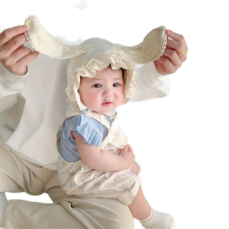 Sombrero de bebé primavera y verano nuevo estilo protector solar para bebés, encaje para bebés y niños pequeños, gorras de palacio de luna pequeña, gorras de protección para los oídos de fontanela