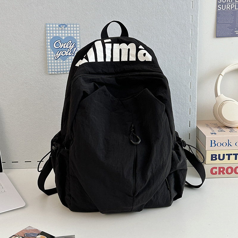 Mochila escolar 2025 nicho ligero y anti-salpicaduras de agua estudiantes de secundaria hombres y mujeres deportes de gran capacidad al aire libre mochila de viaje