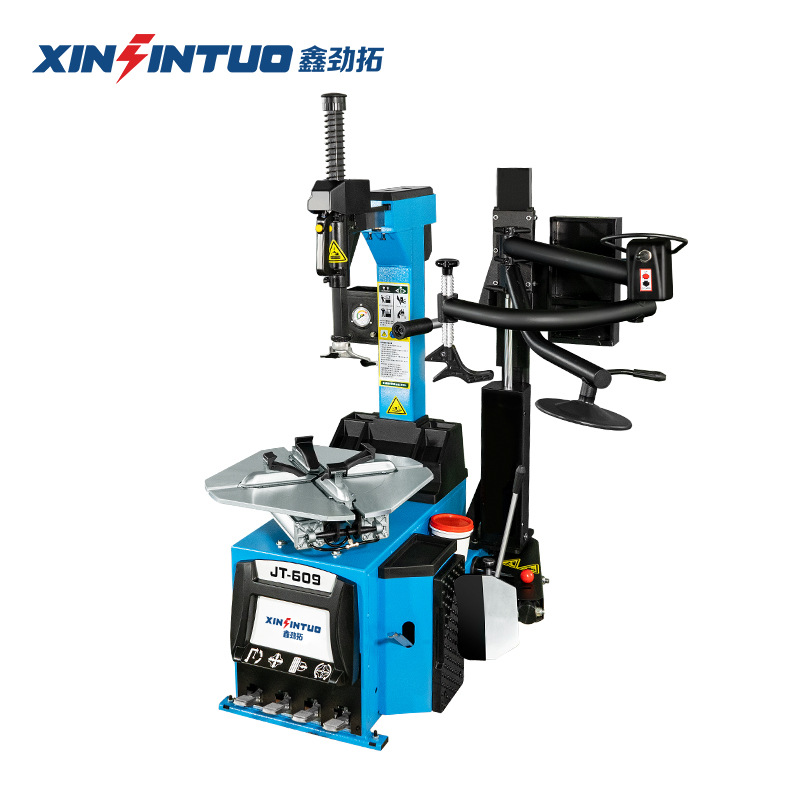 Desmontadora de neumáticos totalmente automática Jintuo, máquina desmontadora de neumáticos potente a prueba de explosiones con brazos auxiliares duales y sistema neumático.
