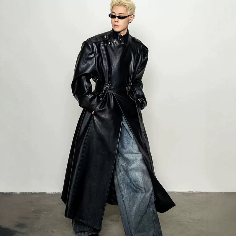 Retro dark high-end faux leather coat with a large collar and a cinched waist, creating a powerful and avant-garde silhouette, long trench coat for men Retro dark high-end faux leather coat with a large collar and a cinched waist, creating a powerful and avant-garde silhouette, long trench coat for men