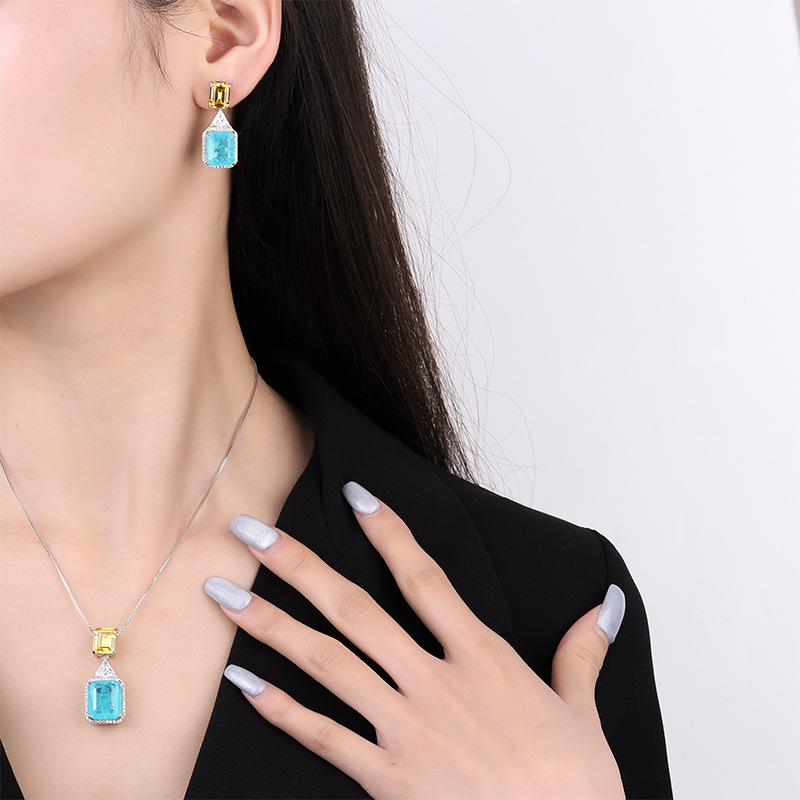 Zhuang sheng joyas de cobre inferior chapado en oro de simulación de moda esmeralda palaiba de dos colores de piedra principal traje de temperamento de las mujeres