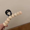 4# светло-розовый большой зажим с глазком-стразой