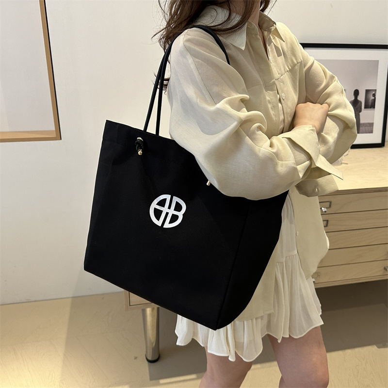 Bolsa de lienzo de gran capacidad de letras para mujeres este año nueva bolsa de hombro de moda universal bolsa de viaje bolsa de mano bolsa de mamá