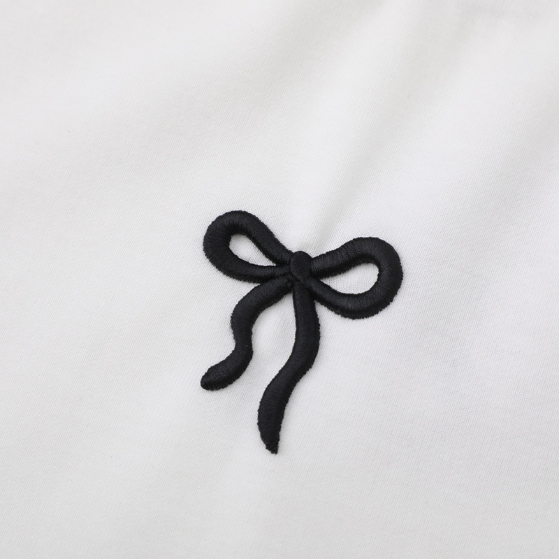 White doll with bow