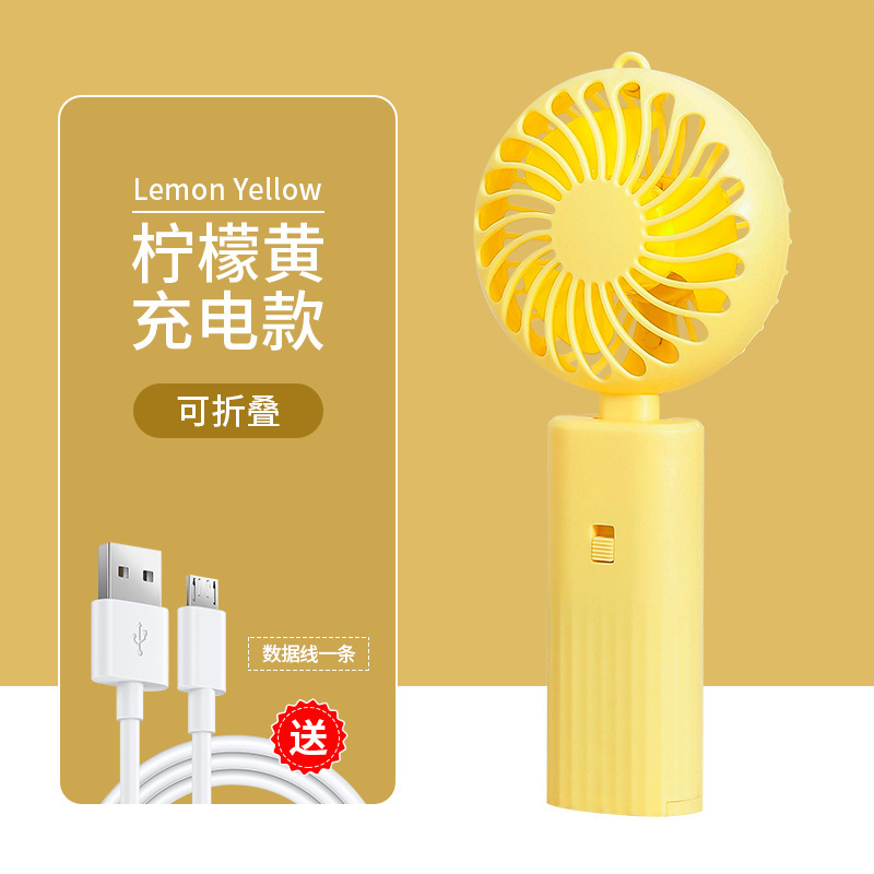 Venta al por mayor mudo gran viento plegable ventilador de mano niños portátil mini ventilador N ° 5 batería regalo LOGO
