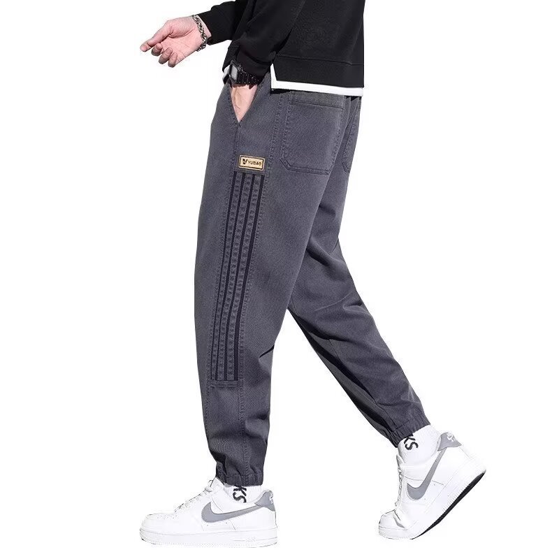 Pantalones casuales de hombre primavera y otoño 2025 nueva marca de tendencia pie abrazado pantalones deportivos juveniles pantalones de hombre otoño y invierno