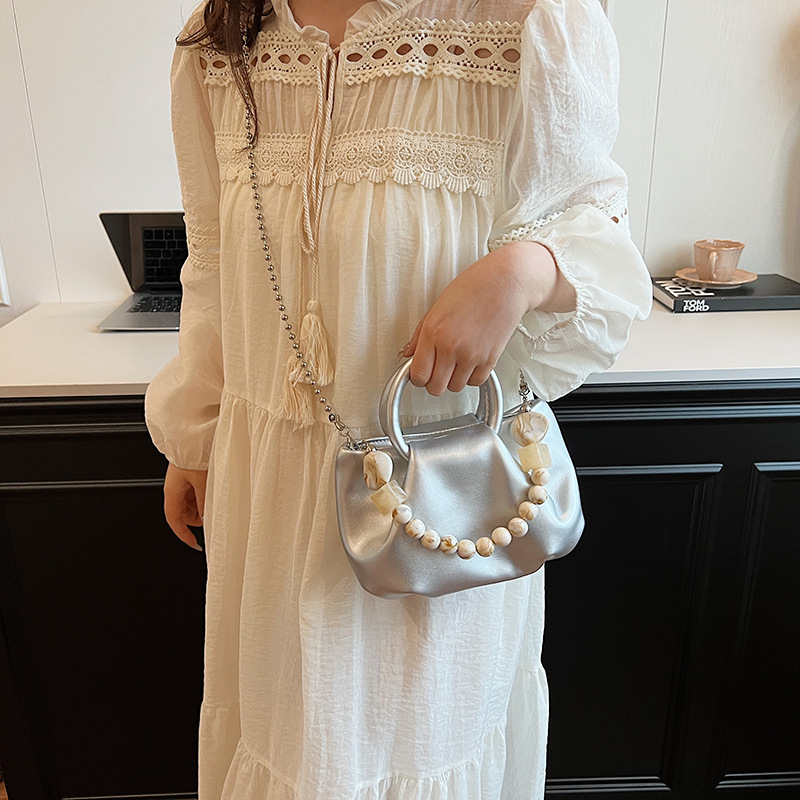 High end handbag for women in 2024, new niche design, summer handheld pleated chain strap, crossbody cloud bag_voghion.com