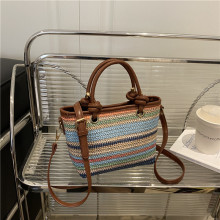 小众彩色条纹草编水桶包包女2025夏季新款洋气个性潮流单肩斜挎包