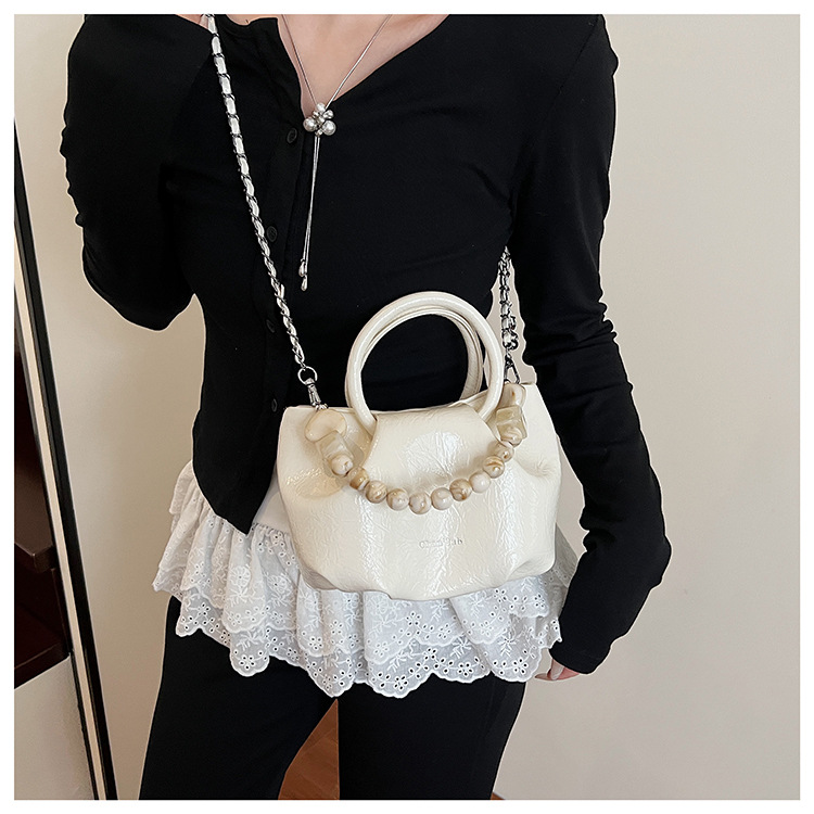 A stylish and trendy beaded bag for women, a new summer chain crossbody cloud bag for women in 2025 undefined