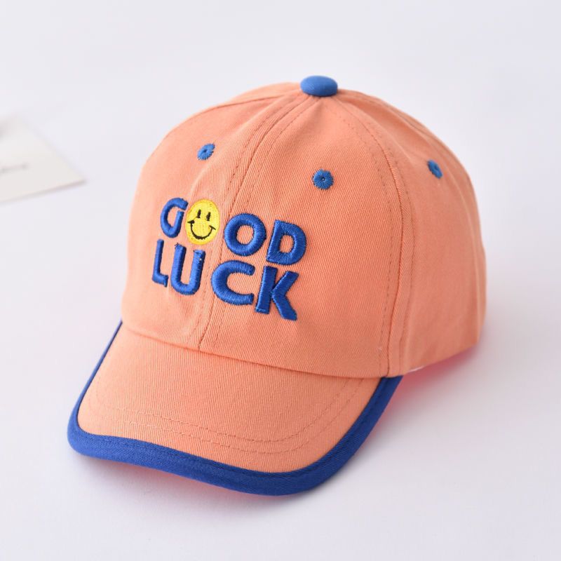 Orange tape, baseball cap